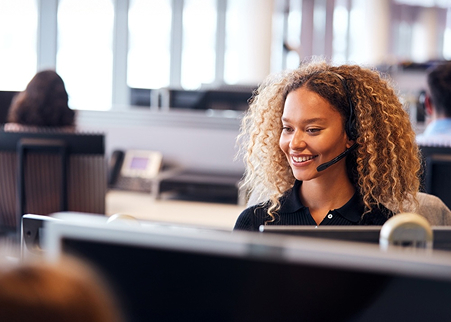 Woman smiling while working at a desk
